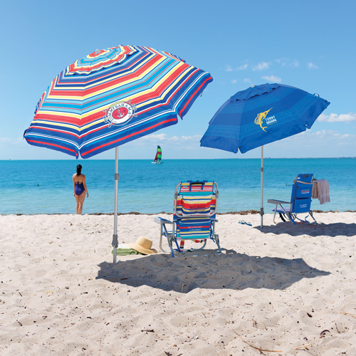 A beach with two umbrellas and chairs on it